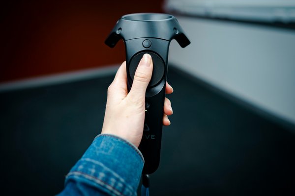 How can developers create seamless integration of AR and VR in hybrid gaming experiences?